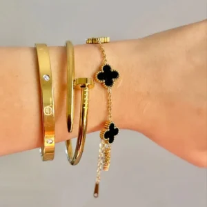 Cartier Nail Love bangle with black clover bracelet Stack